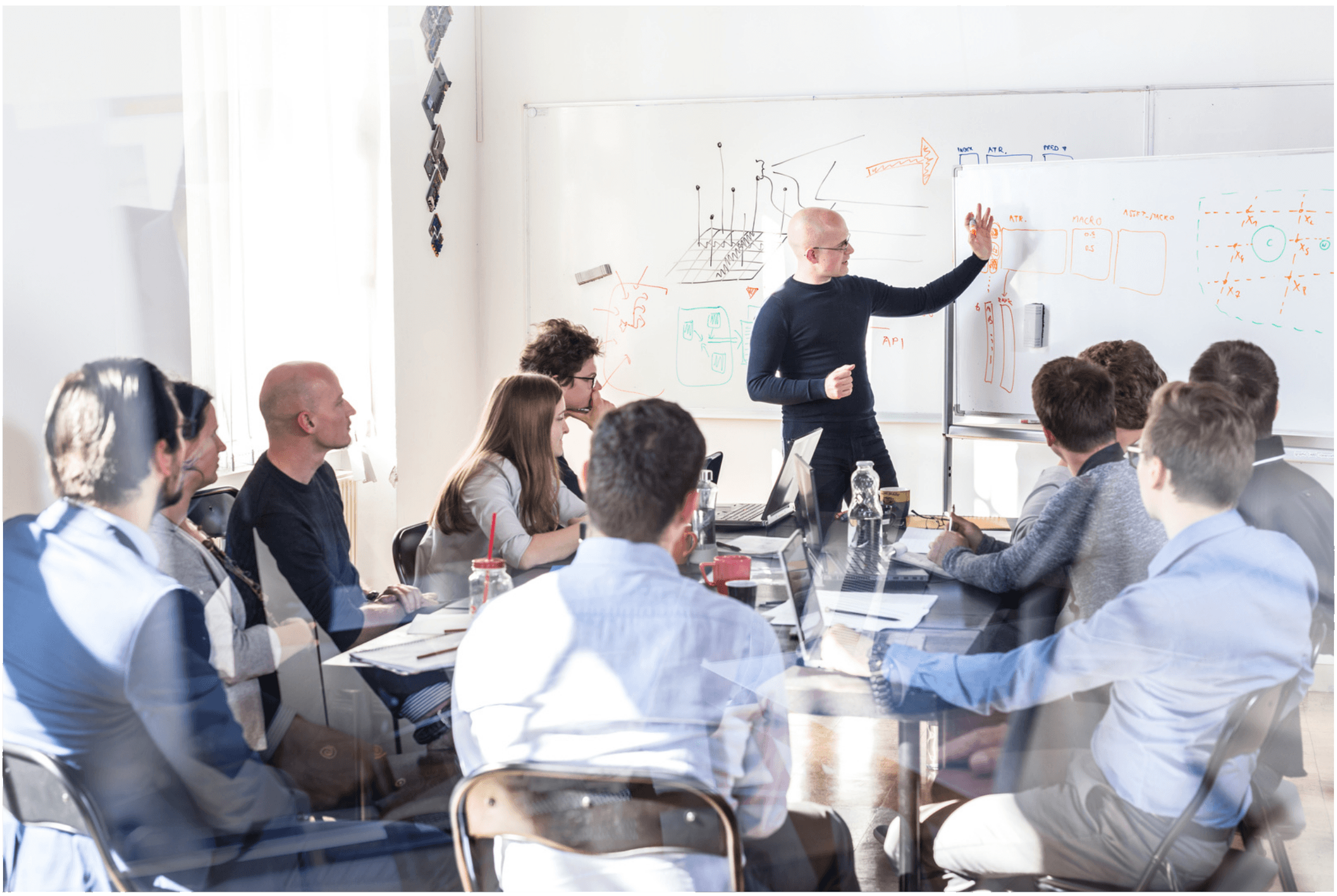 A consultant speaks to an audience, sharing insights in a presentation.